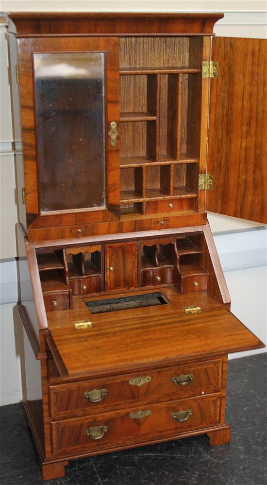 A Fergus Lane miniature 18th century style walnut bookcase,